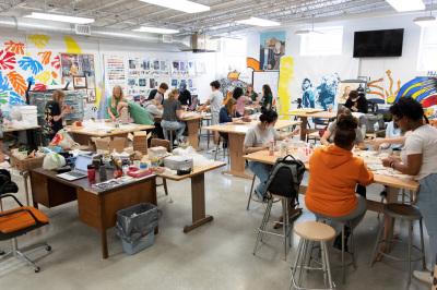 Ceramics class shaping vessels in the art studio